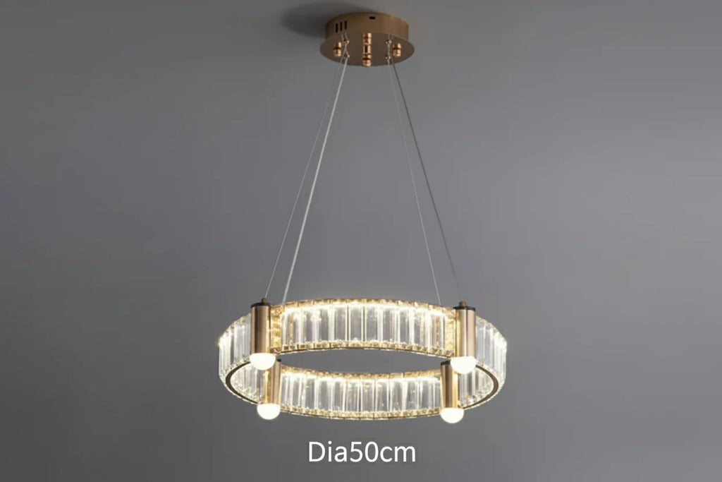 Modern gold-frame chandelier with circular LED rings and glass accents, 50cm diameter. Contemporary design.
