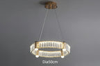 Modern gold-frame chandelier with circular LED rings and glass accents, 50cm diameter. Contemporary design.