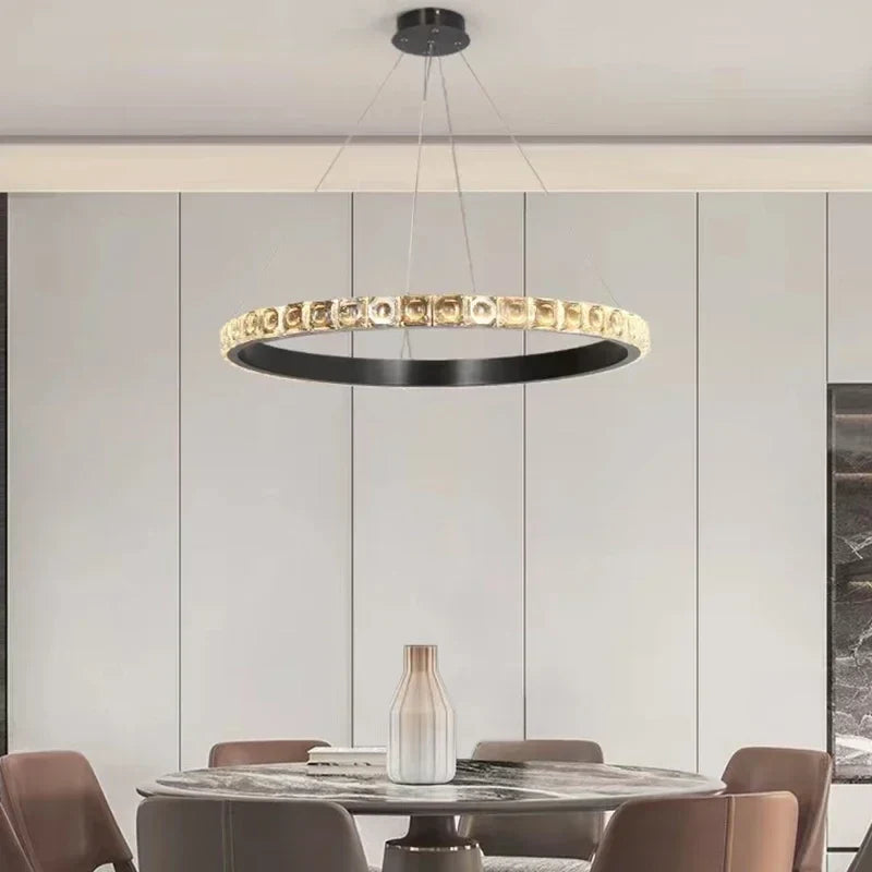 Maison Ornate Luxury Crystal Chandelier hangs overhead, featuring intricate crystal details and elegant illumination.