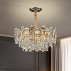 Modern LED crystal chandelier with rope-wrapped rod, vertical prisms, and warm ambient illumination.