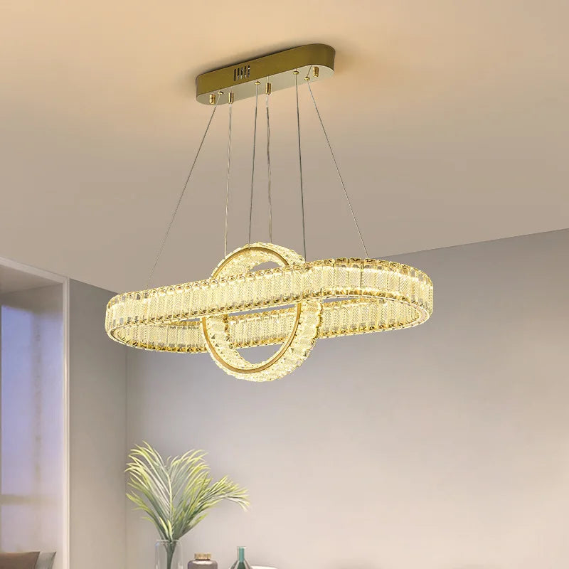 Maison Ornate Modern LED Crystal Pendant Light featuring oval ring and intersecting circle design suspended by four wires.