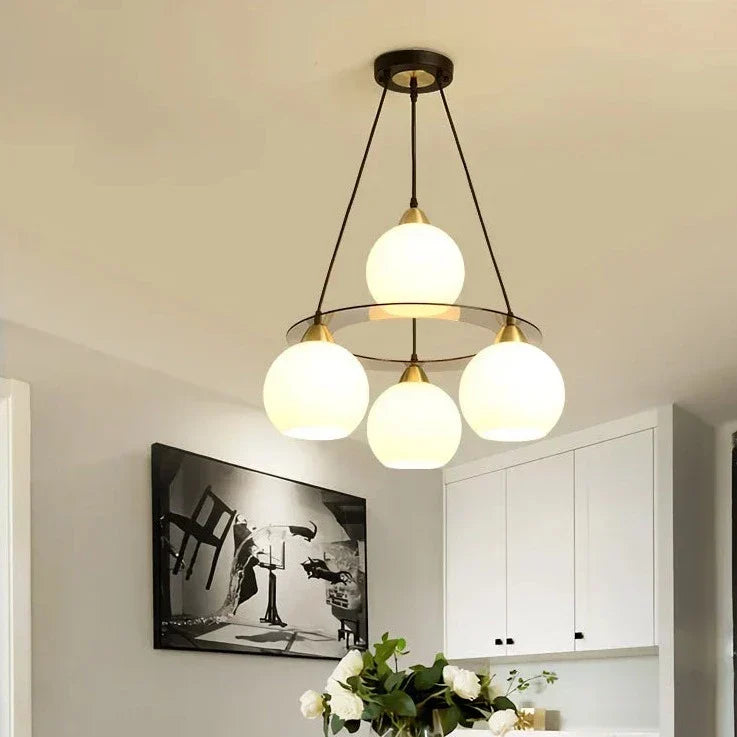 Modern crystal chandelier with three round heads by Maison Ornate, Art Deco-inspired lighting fixture.