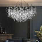 The Maison Ornate Modern Crystal LED Chandelier with polished aluminum design and sparkling crystal accents.