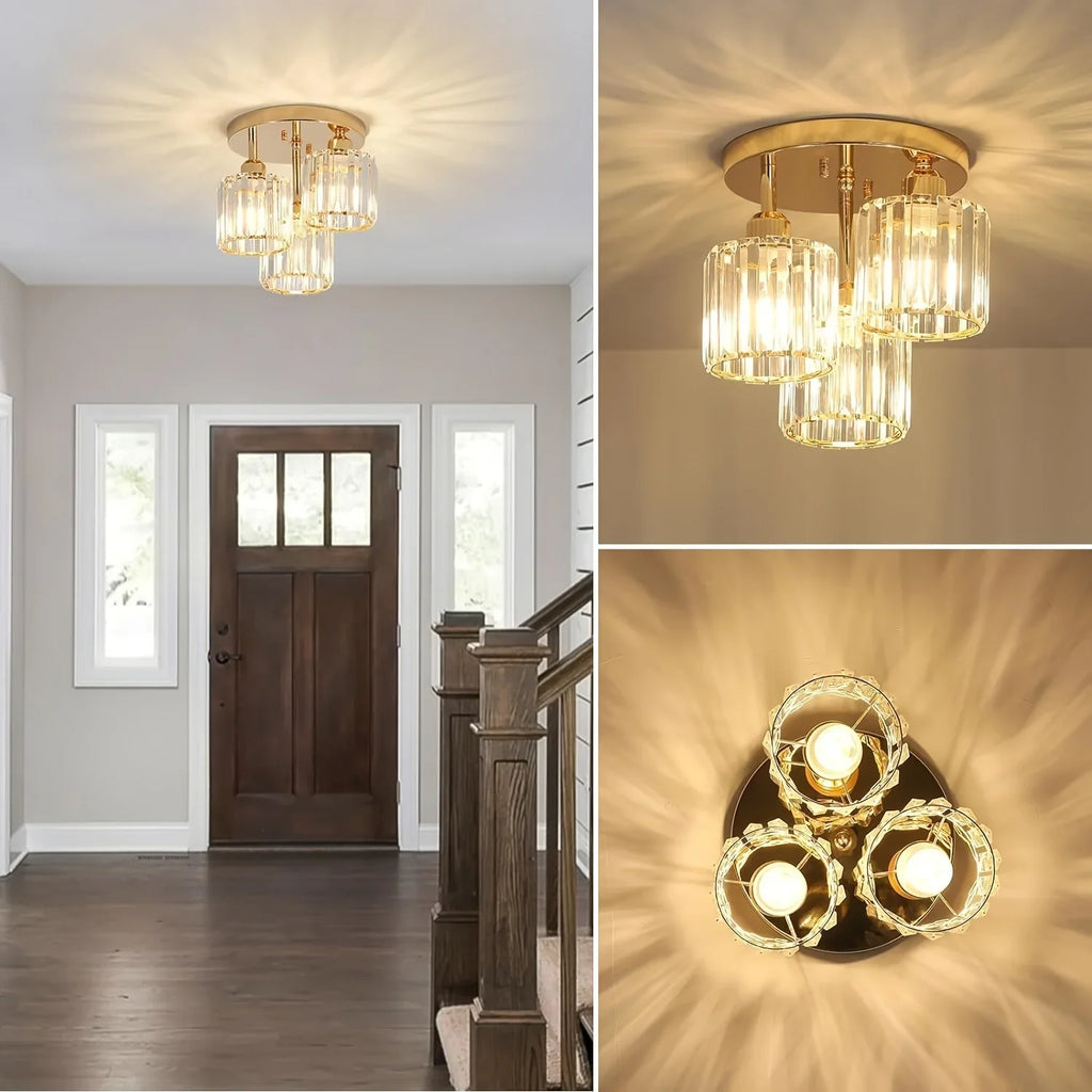Maison Ornate gold and crystal three-light iron chandelier with glass cylinder shades, shown in detail.
