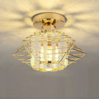 Modern industrial chandelier with gold geometric metal frame and crystal accents, casting decorative light.