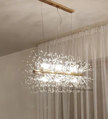 Gold bar chandelier with elegant crystal branch details and LED lights; sophisticated, luxurious lighting fixture.