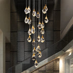 Elegant Maison Ornate crystal chandelier with LED lights and gold accents, suspended by thin wires.