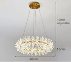 Modern crystal chandelier with gold accents, floral details, three cables; 60cm diameter, adjustable height.