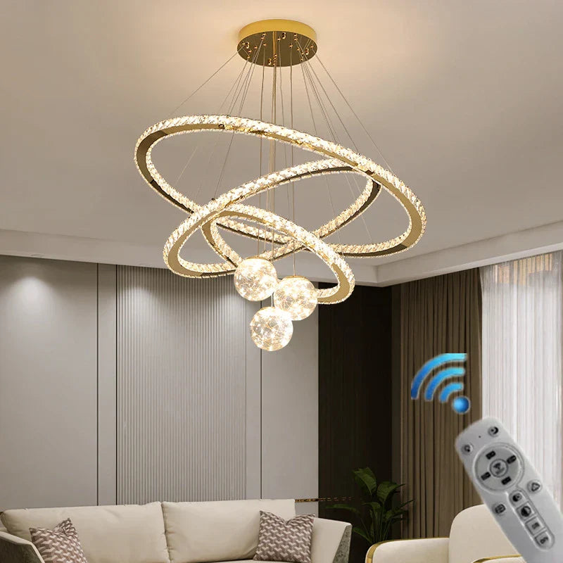 Maison Ornate Golden Crystal Chandelier featuring LED rings and glass balls, luxurious modern lighting fixture.