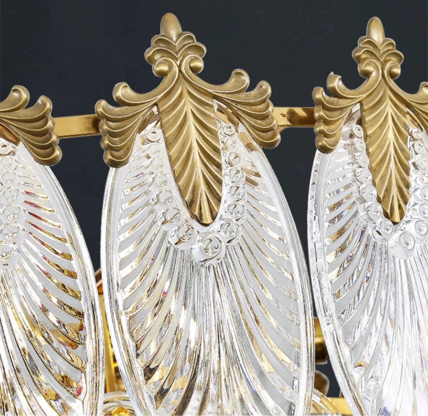 Close-up of Retro Leaf Crystal Art Deco LED chandelier with gold accents and intricate textures.