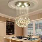 Maison Ornate Modern Spherical Crystal Chandelier in polished steel LED, elegantly suspended overhead.