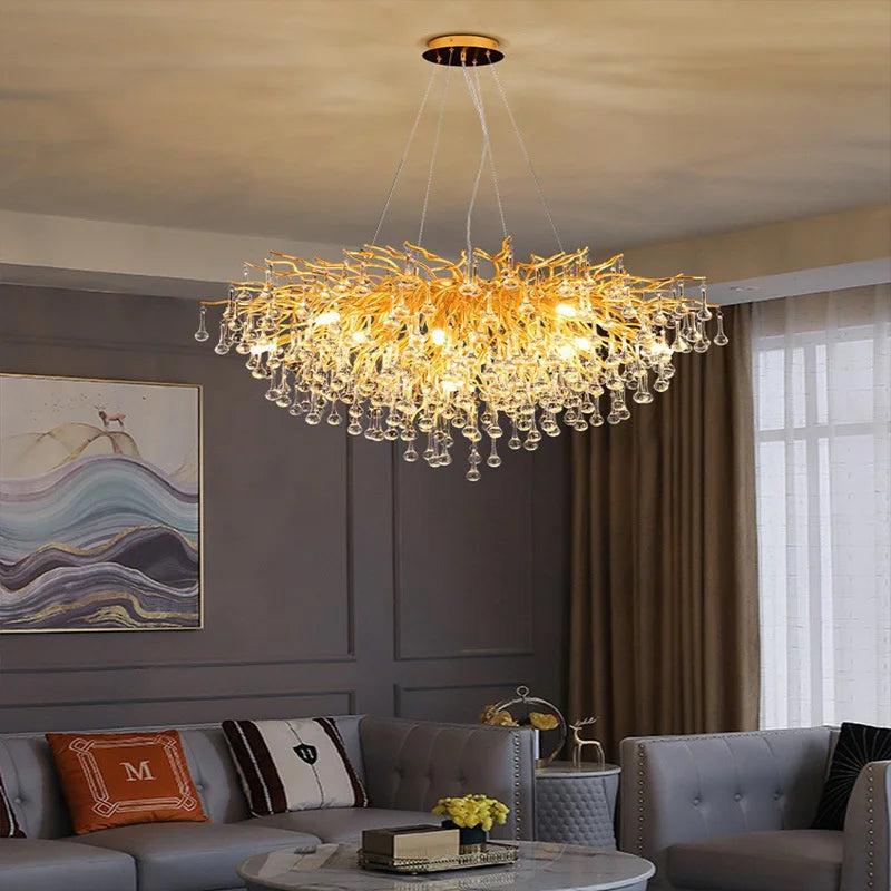 Maison Ornate’s Modern Interior LED Crystal Chandelier with branch-like arms and hanging glass droplets.
