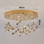 Maison Ornate Modern Crystal LED chandelier with gold round base, flower-shaped clear/gold crystal ornaments.
