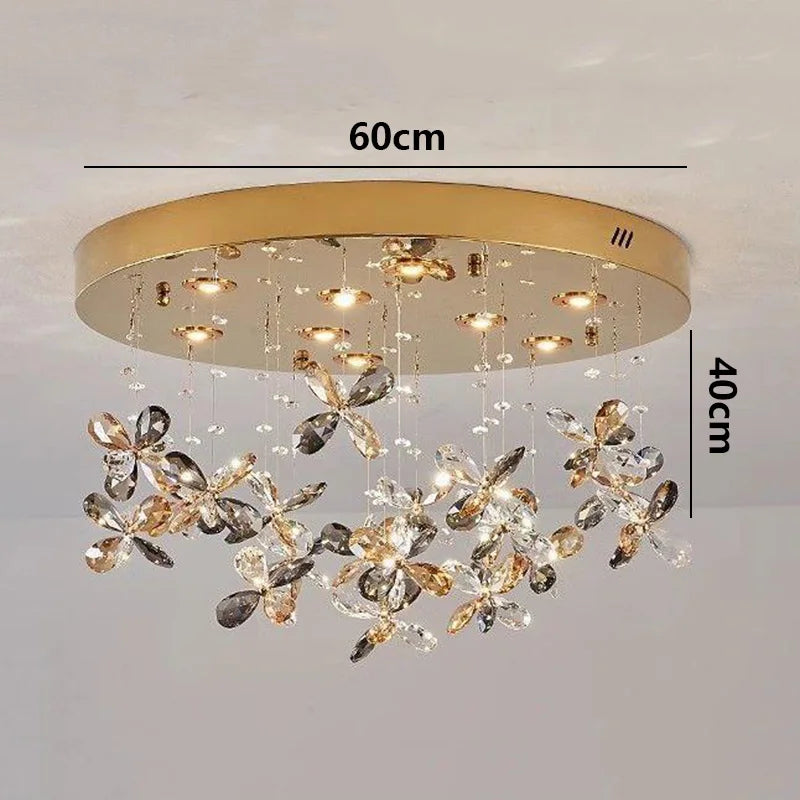 Maison Ornate Modern Crystal LED chandelier with gold round base, flower-shaped clear/gold crystal ornaments.