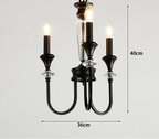 Black three-arm vintage chandelier with crystal accents, candle-style LED bulbs, luxury finish, 40x36 cm.