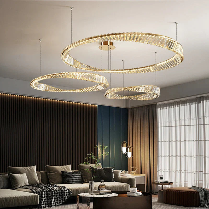 Three Maison Ornate Industrial Crystal LED Chandeliers hang stylishly, showcasing elegant modern lighting design.