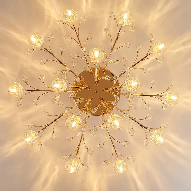 Maison Ornate Golden Crystal Chandelier features LED lit glass flowers and detailed golden floral accents.