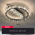 Circular stainless steel chandelier with crystal accents, LED, 62 cm wide, 14 cm high, modern design.