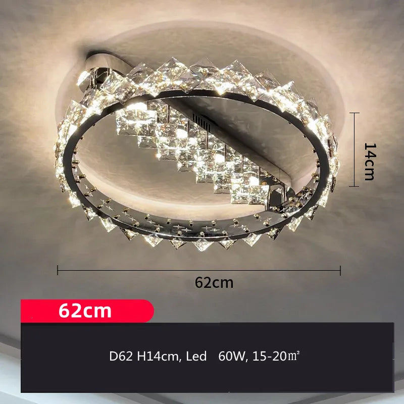 Circular stainless steel chandelier with crystal accents, LED, 62 cm wide, 14 cm high, modern design.