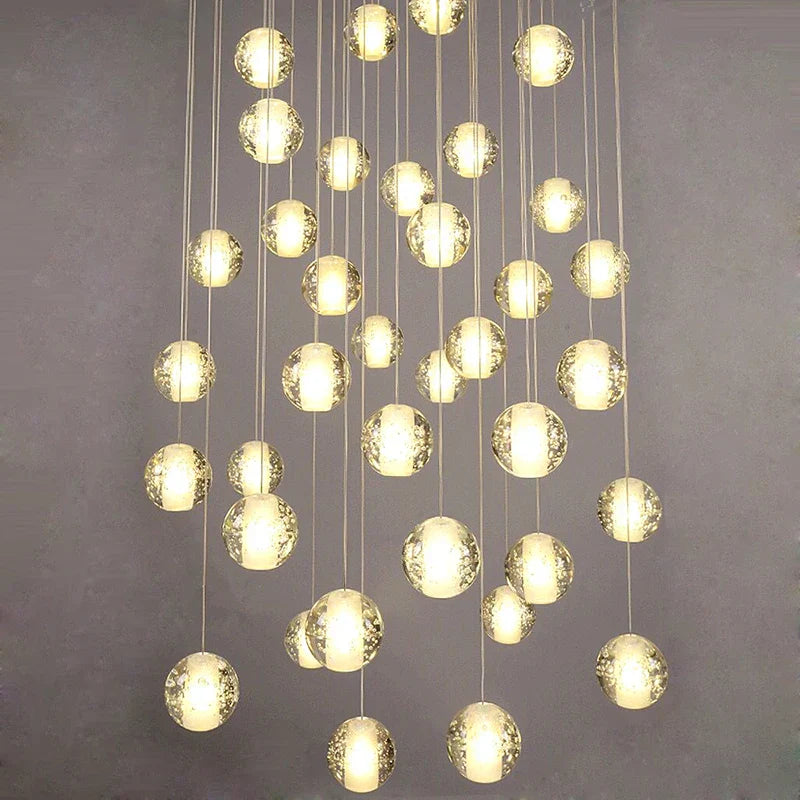 Maison Ornate Crystal Sphere Chandelier with LED, featuring glowing pendants at varying heights.