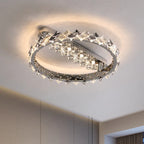 Ornate stainless steel chandelier with two concentric rings and LED lighting, modern crystal accents.