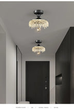 Two French Medieval Style Crystal Teardrop Chandeliers by Maison Ornate with sparkling crystal accents.
