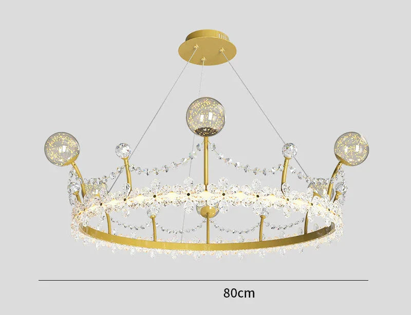 Gold crown-shaped chandelier with crystal balls, beads, and four suspension wires; 80 cm wide.