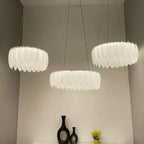 Three Crystal Ball Chandeliers with glass and decorative feathers by Maison Ornate, showcasing Nordic elegance.