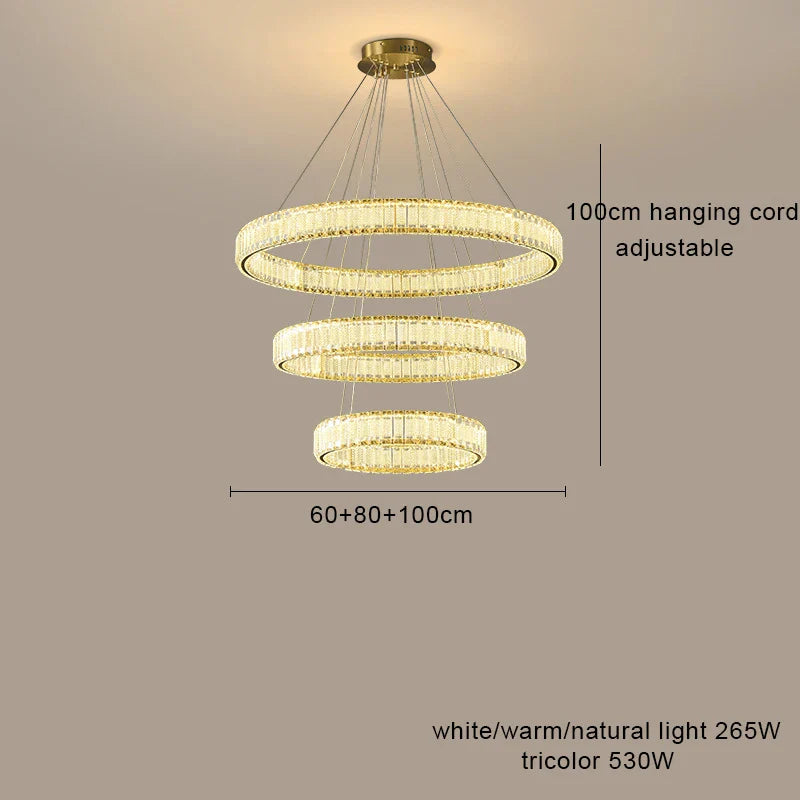 Modern LED crystal chandelier with three circular tiers, dimmable light, adjustable wires, and sparkling crystal accents.