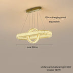 Oval crystal LED chandelier with four adjustable cords, rectangular ceiling mount, dimmable tri-color lighting.