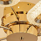 Close-up of Maison Ornate LED Crystal Chandelier with textured glass shades and polished gold finish.