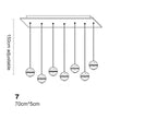 Crystal Sphere Chandelier with 7 adjustable pendants and rotating LED, sleek rectangular base. Modern design.