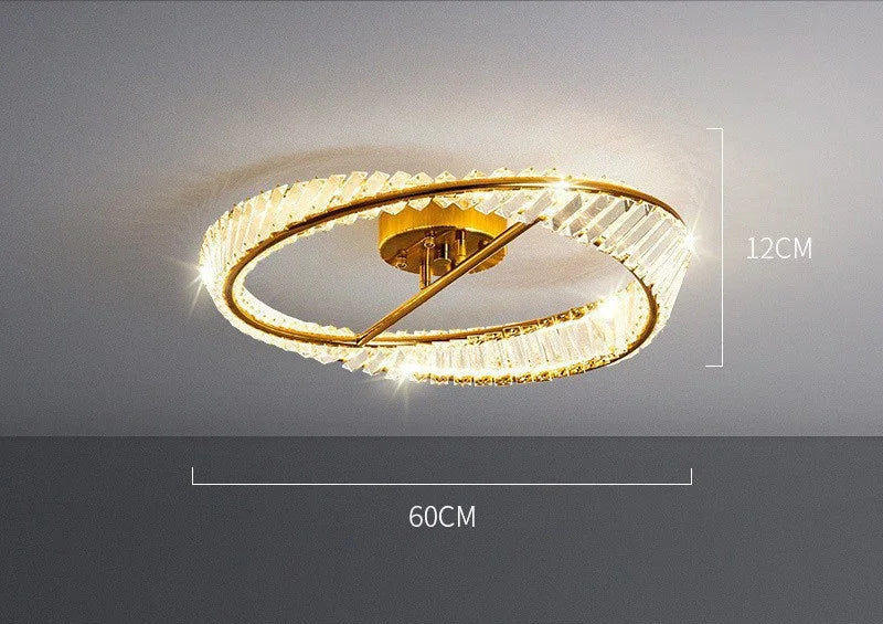 Modern gold-finished chandelier with two crystal-edged rings, dimmable LED lighting, 60x12 cm.