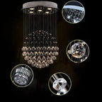 Modern spherical crystal chandelier with polished steel, multiple LED-lit crystal spheres, and detailed textures shown close-up.