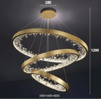 Three overlapping crystal rings chandelier with dimmable LED lighting, modern design, adjustable height.