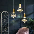 Three Nordic diamond design crystal chandeliers with gold fixtures and ornate crystal detailing.