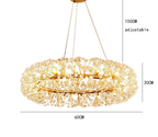 Gold and crystal Art Deco chandelier with circular dandelion design, adjustable suspension, 60cm wide.