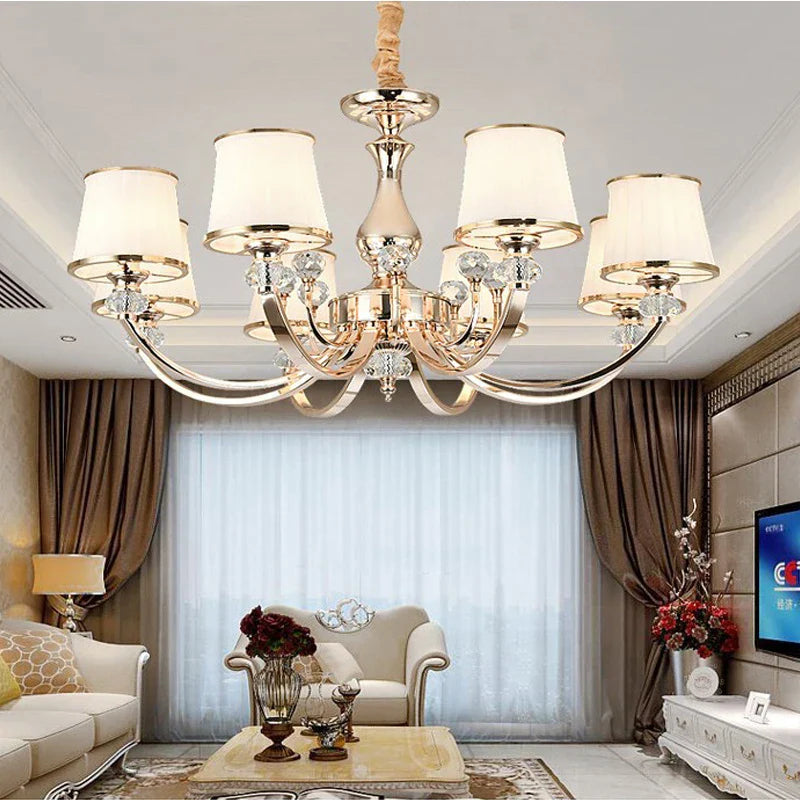 Maison Ornate Luxury Baroque Crystal Chandelier with six white shades and integrated LED lighting.