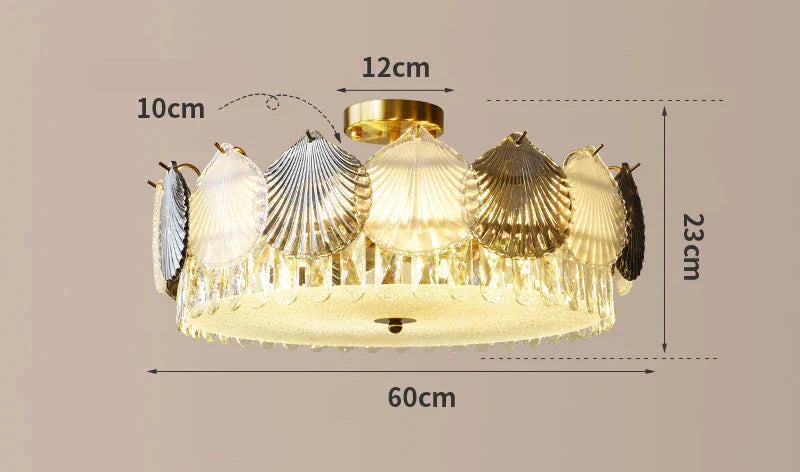 Shell-shaped glass chandelier with gold finish, LED lights, 60x23cm size emits warm glow.