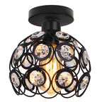 Chic chandelier with round black metal frame, circular crystal accents, and exposed vintage-style bulb.