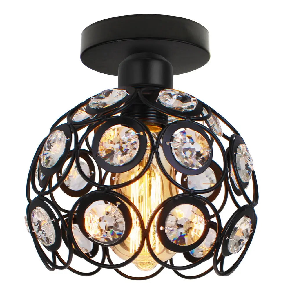 Chic chandelier with round black metal frame, circular crystal accents, and exposed vintage-style bulb.