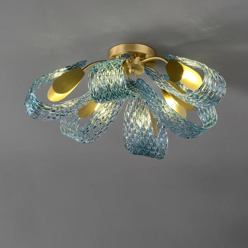 Gold-base chandelier with six blue textured glass petals and bulbs, forming a floral LED pendant.