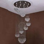 Modern crystal chandelier with stainless steel mount, thin wires, and clusters of cascading crystal balls.