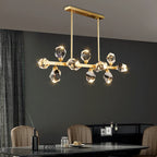 Maison Ornate Modern Glass Crystal Chandelier features brass structure and LED lighting. Contemporary, elegant ceiling fixture.