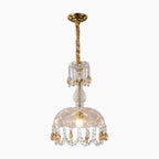 Art Deco crystal chandelier with LED lights, gold detailing, hanging crystals, glass shade, gold mount.