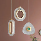 Set of three ornate Art Deco chandeliers with gold and emerald accents in oval, circular, triangular shapes.