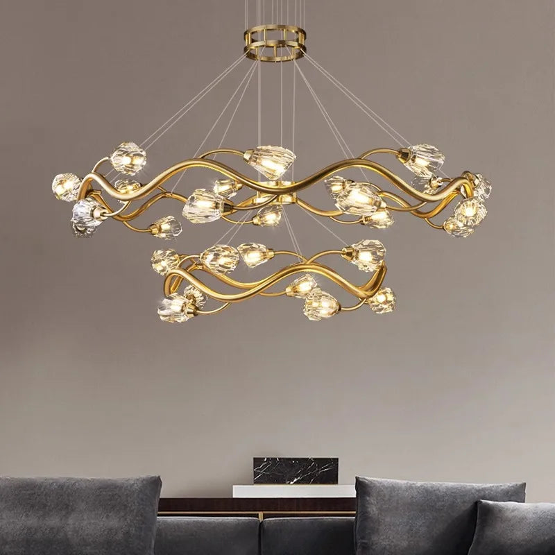 The Maison Ornate LED Crystal Pendant has twisting wave arms and glass bulbs, elegantly suspended.