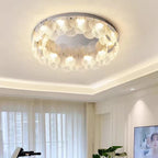Maison Ornate Postmodern Chandelier with LED lights and leaf accents, emits a warm glow.