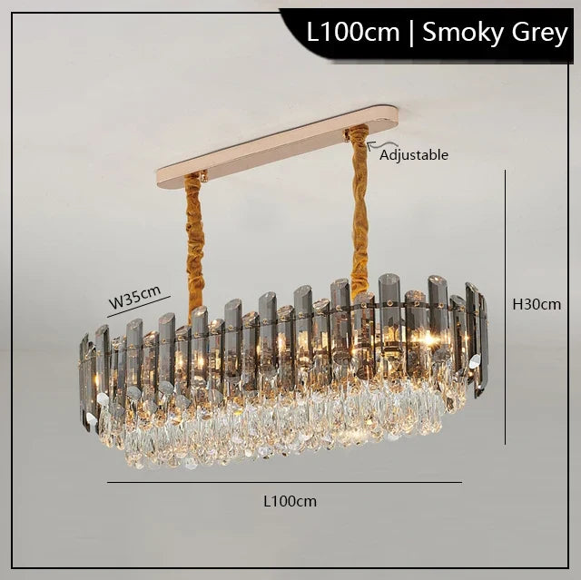 Rectangular smoky grey crystal chandelier with gold cords and sleek ceiling mount, 100×35×30cm.