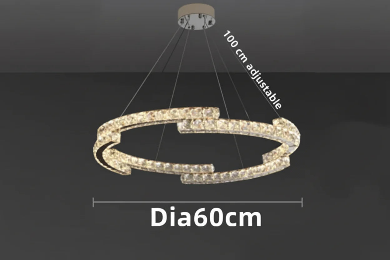 Modern circular chandelier, stainless steel, crystal accents, 60 cm wide, LED lighting, adjustable hanging.